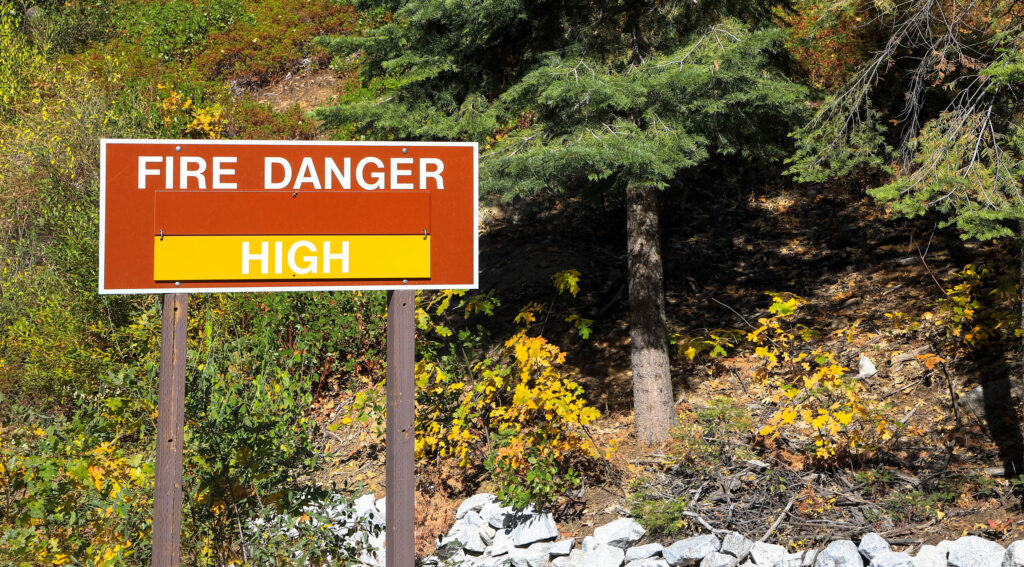 A sign in a national park warns residents of the high wildfire danger in summer